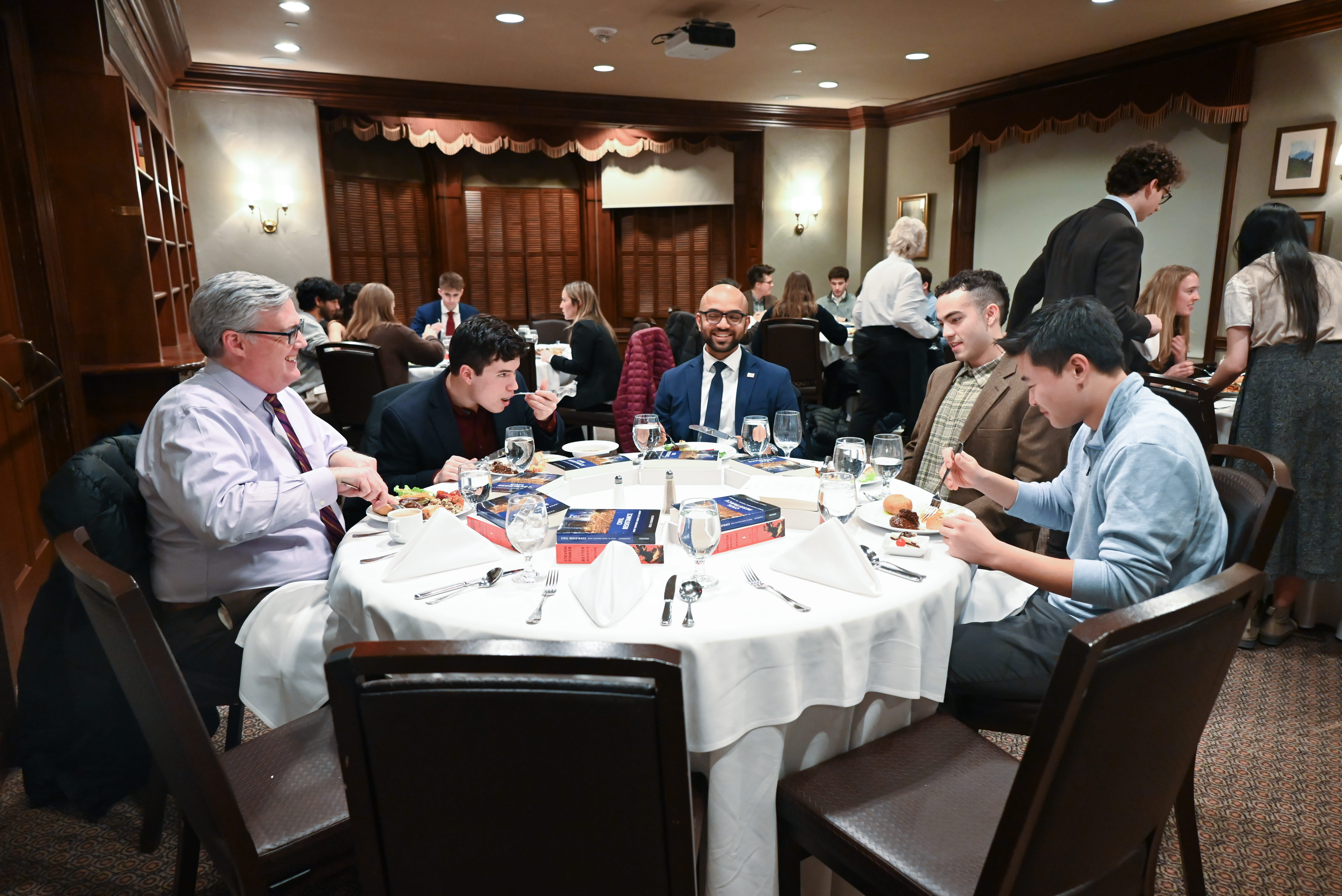 Post-faculty dialogue, student administrators further discuss the topic over a shared meal.