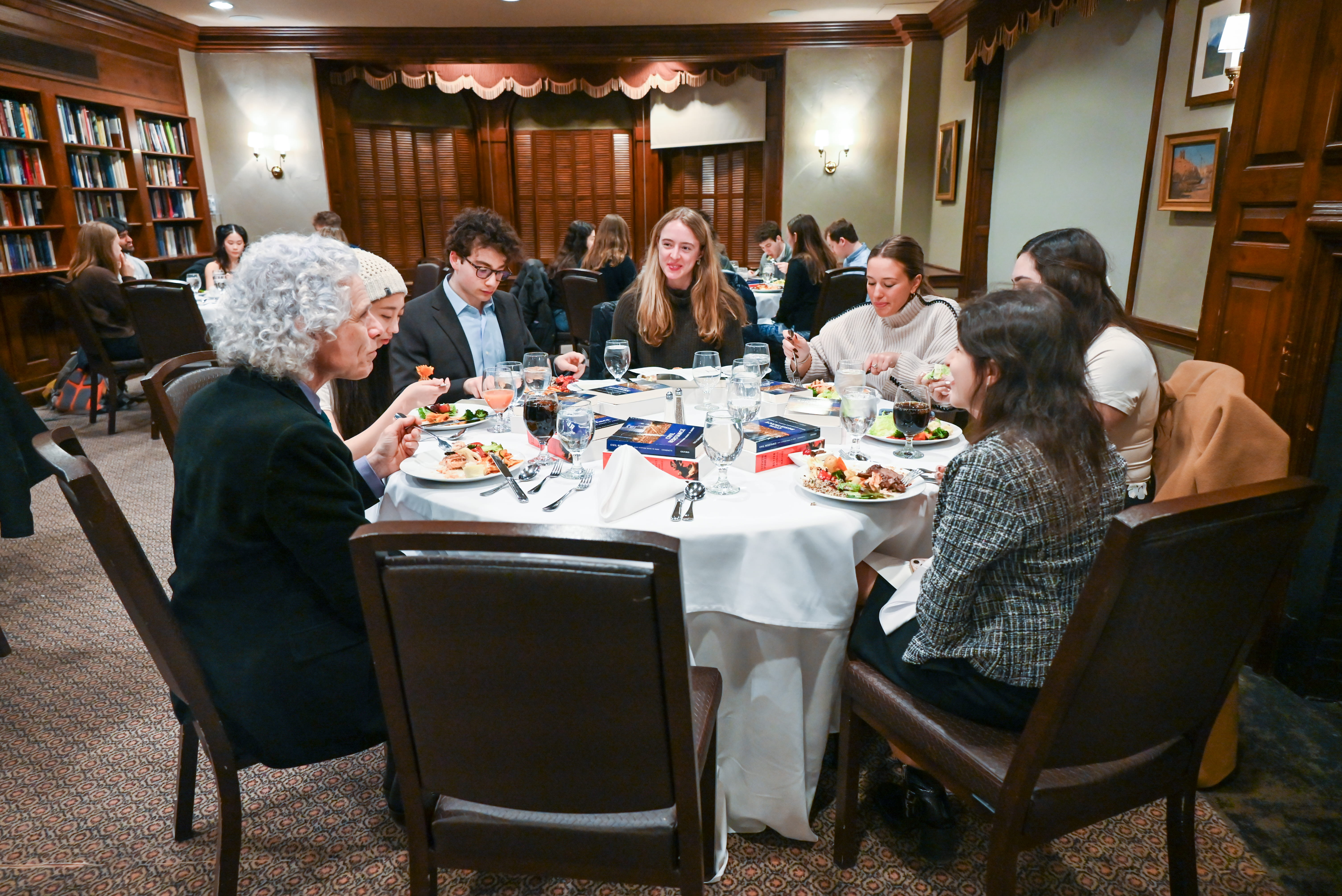 Post-faculty dialogue, students and faculty further discuss the topic over a shared meal.
