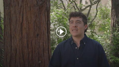 A screenshot of a video of a student speaking.