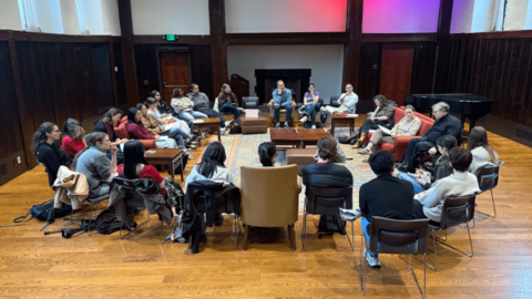 Group of people sitting in a circle in a discussion