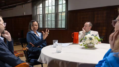 Tomiko Brown-Nagin (center) and other scholars discussing around a circular table