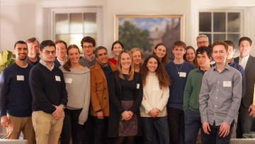 A group of students and staff during event.