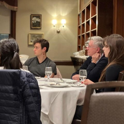 Students listen to a question for Prof. Penslar during dinner at the Faculty Club