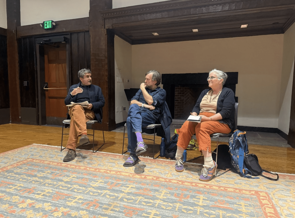 Three professors having a panel discussion