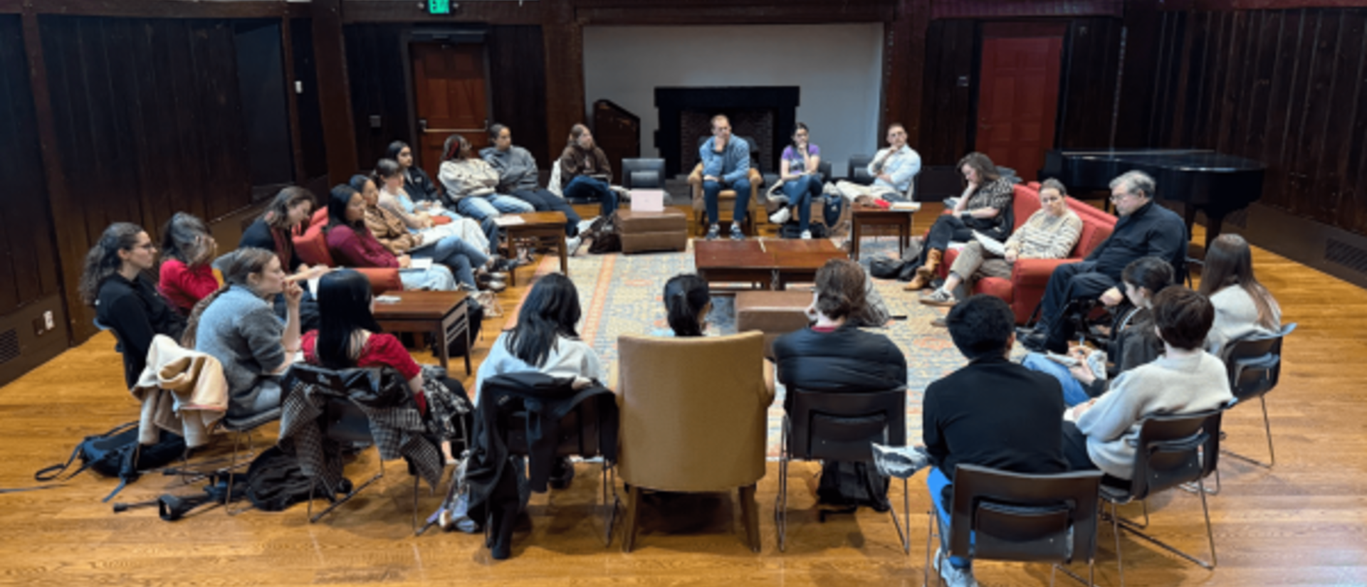 Group of people sitting in a circle in a discussion
