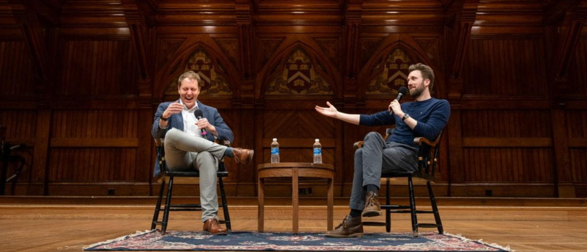 Prof. David Deming and Jordan Klepper on stage