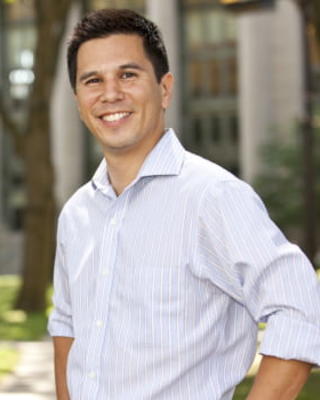 Stephen Chong in front of background.