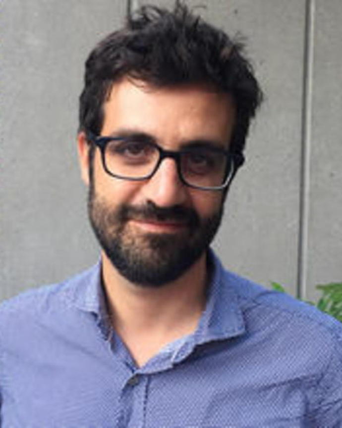 Bruno Carvalho's headshot in front of gray background.